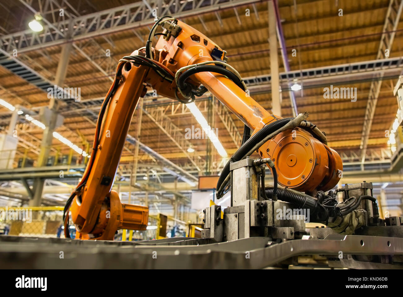 Robot arms handle tool keep automotive part to spot machine in car factory Stock Photo
