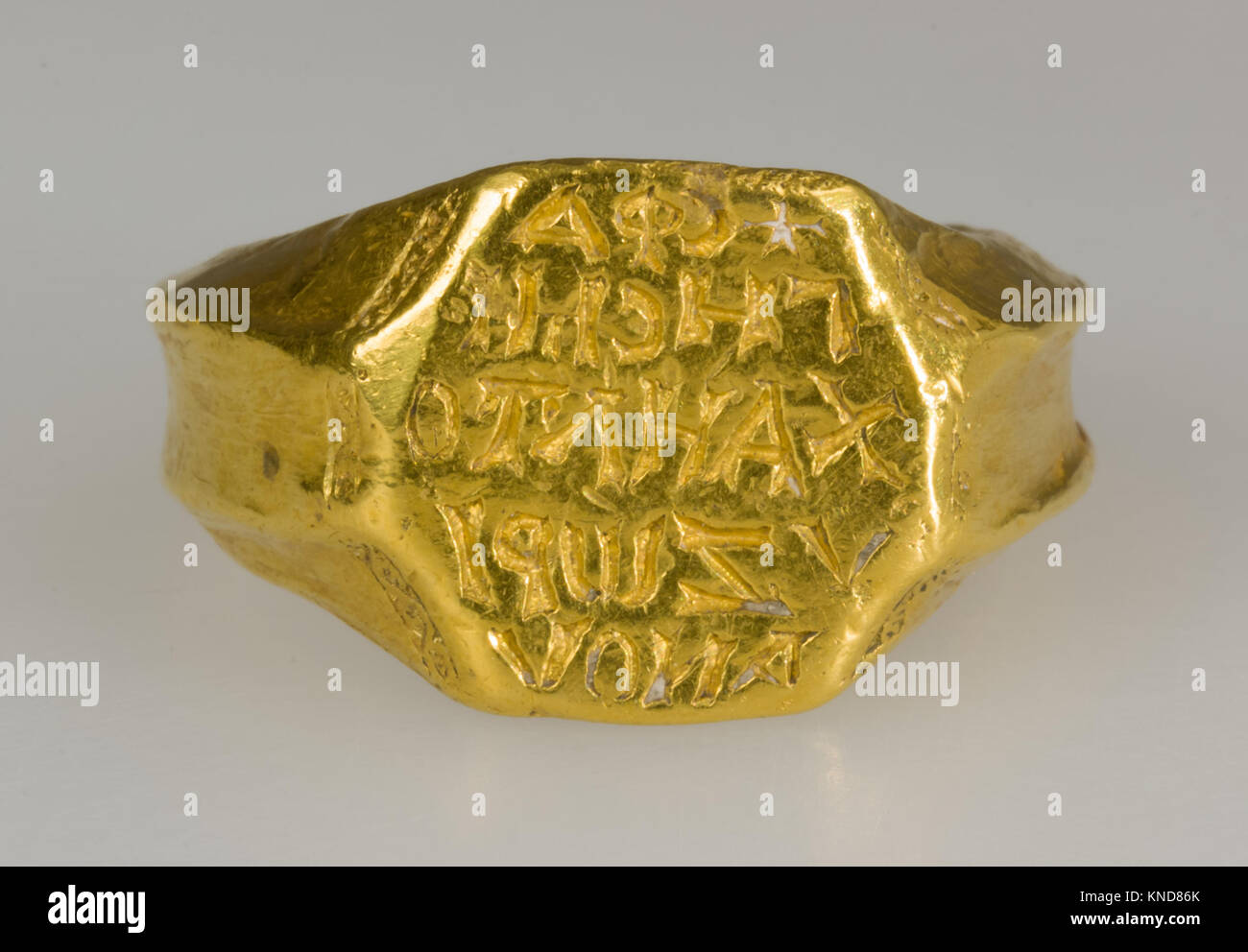 Gold Signet Ring of Michael Zorianos MET LC 18 145 42 s8 465925 Byzantine, Gold Signet Ring of Michael Zorianos, ca. 1300, Gold, 9/16 ? 15/16 in., 0.882oz. (1.4 ? 2.4 cm, 25g) Bezel: 9/16 ? 1/2 in. (1.4 ? 1.3 cm) Inside circumference: 2 1/4 in. (5.7 cm) . The Metropolitan Museum of Art, New York. Rogers Fund, 1918 (18.145.42) Stock Photo
