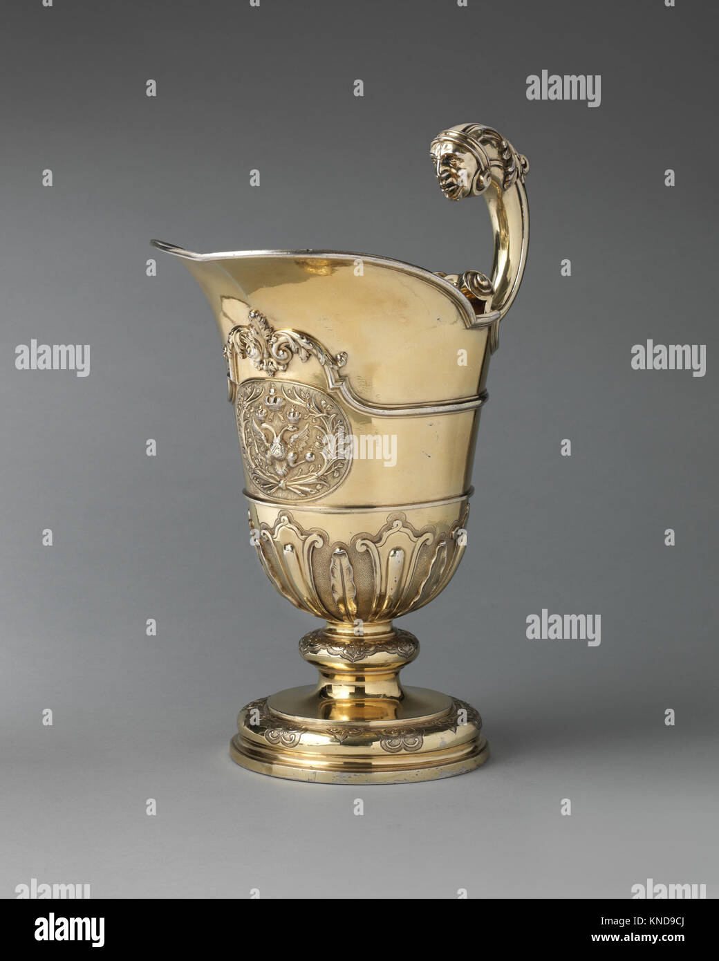 An ewer, a detailed pitcher for holding liquids, illustrates period ...