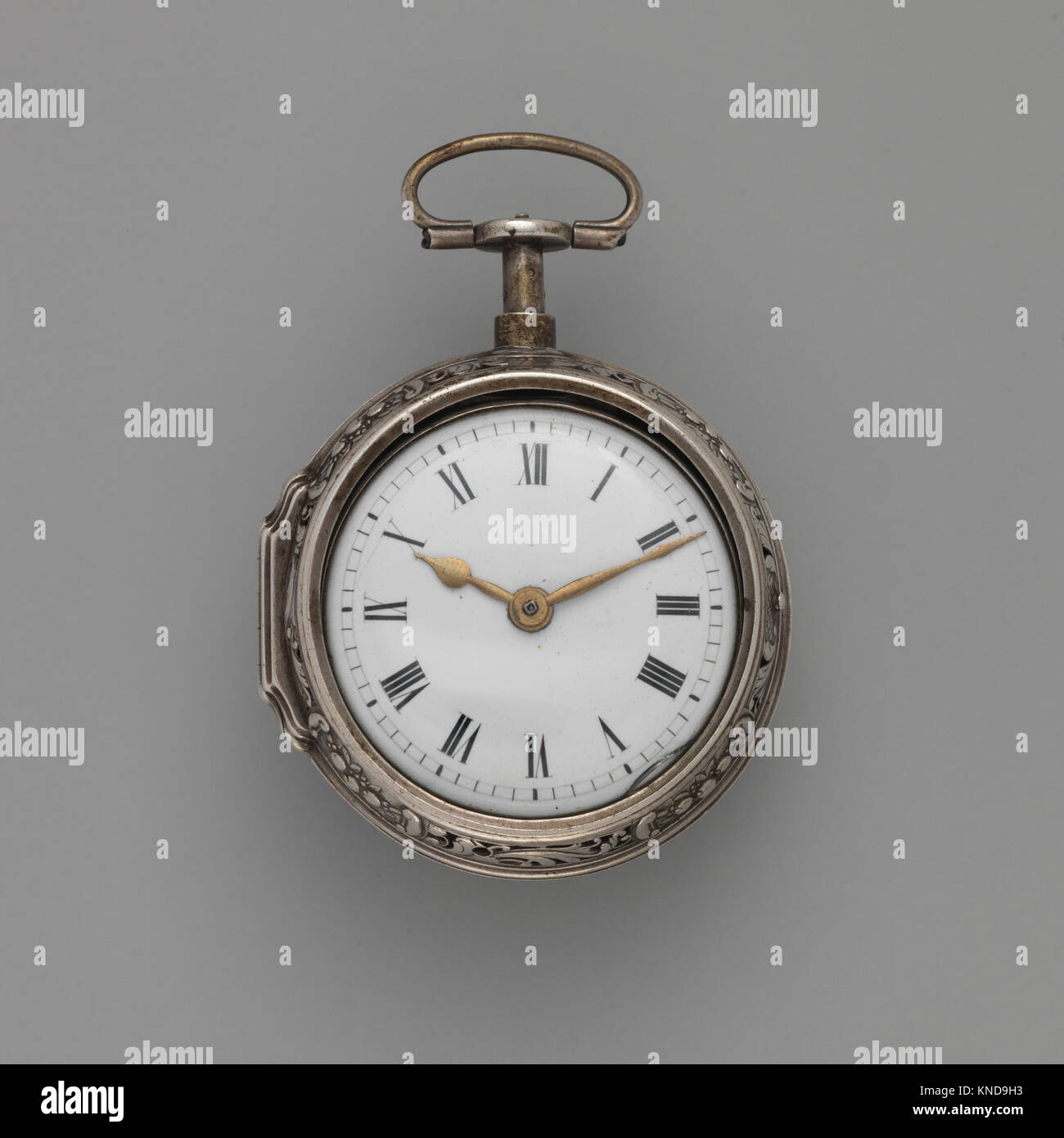 Watched Clock This clock-watch combines elements of a clock and a watch, reflecting ...