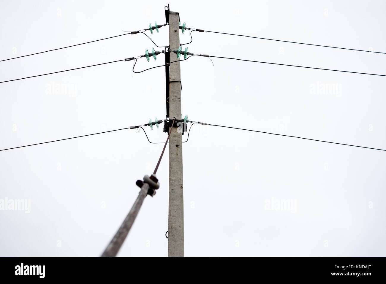 Pole transmission lines with glass insulators Stock Photo Alamy