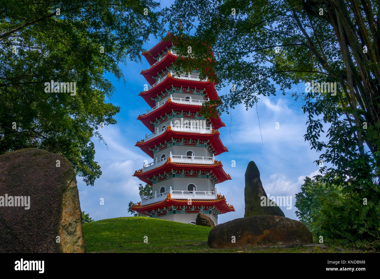 Singapore. Sunny day. Multi-storey pagoda in the park of Singapore surrounded by green trees Stock Photo