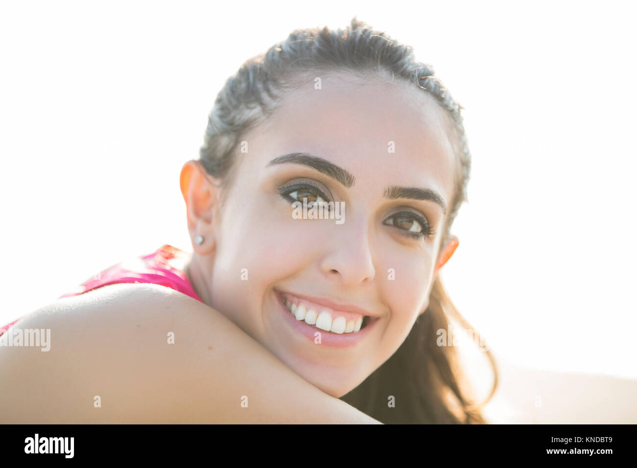 Happy young woman smiling outdoors Stock Photo - Alamy