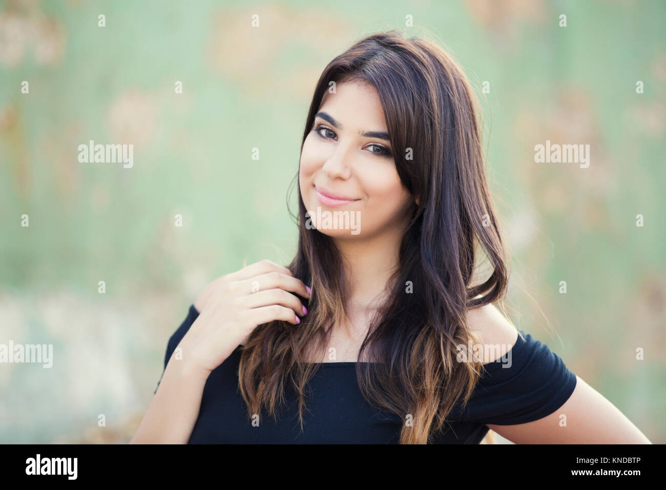 Beautiful young woman smiling outdoors Stock Photo - Alamy