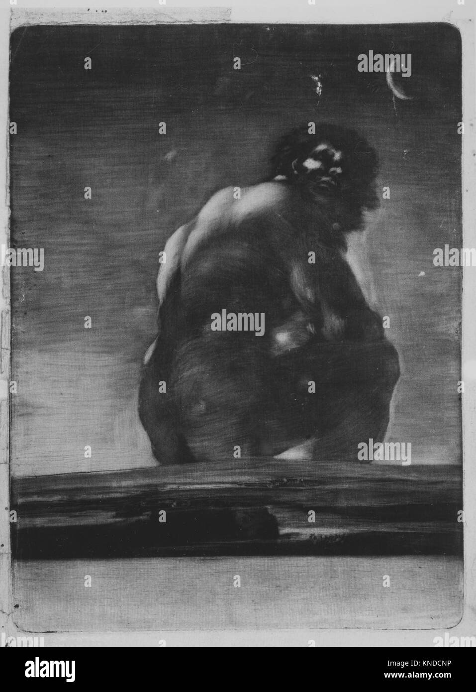 this-large-scale-artwork-the-colossus-shows-a-giant-seated-in-a