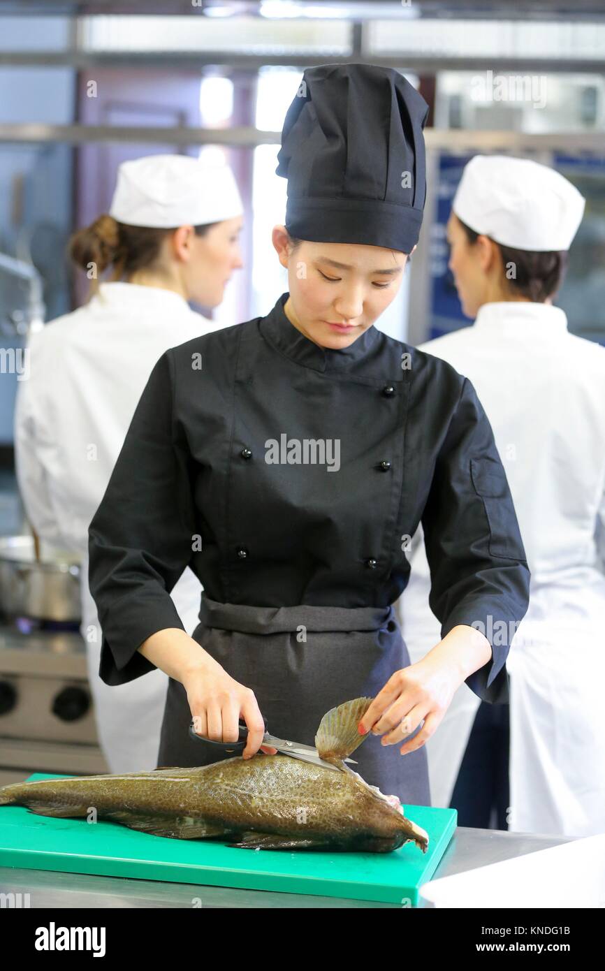 Chef cutting cod, Cook in cooking school, Cuisine School, Donostia, San Sebastian, Gipuzkoa, Basque Country, Spain, Europe Stock Photo