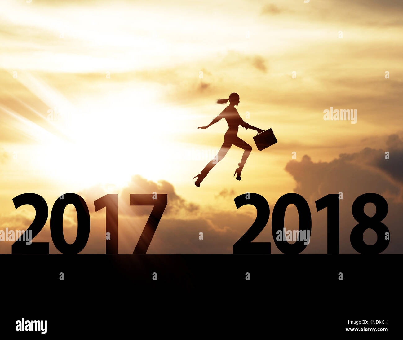 Men jump over silhouette Happy New Year 2018 Stock Photo