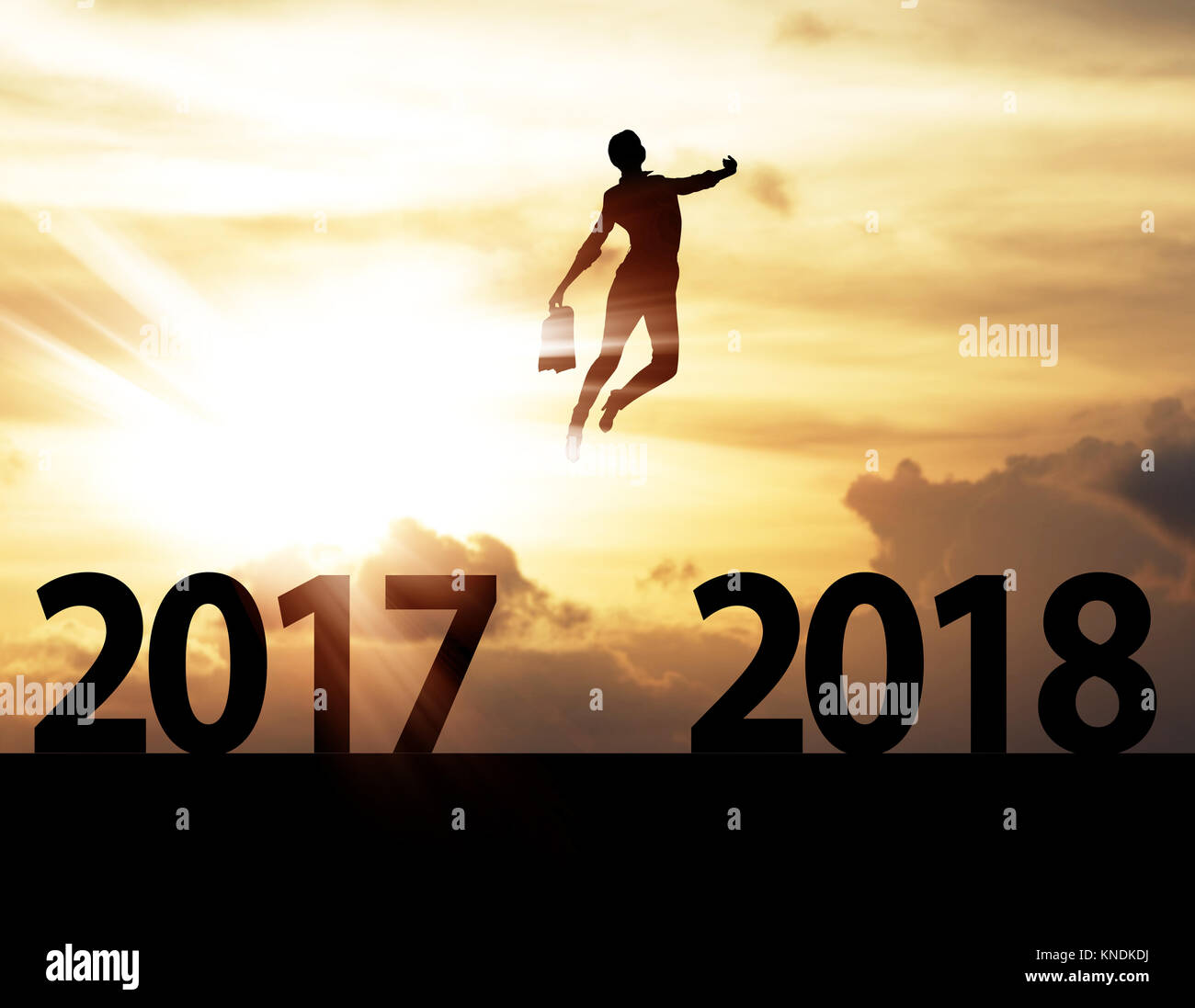 Men jump over silhouette Happy New Year 2018 Stock Photo