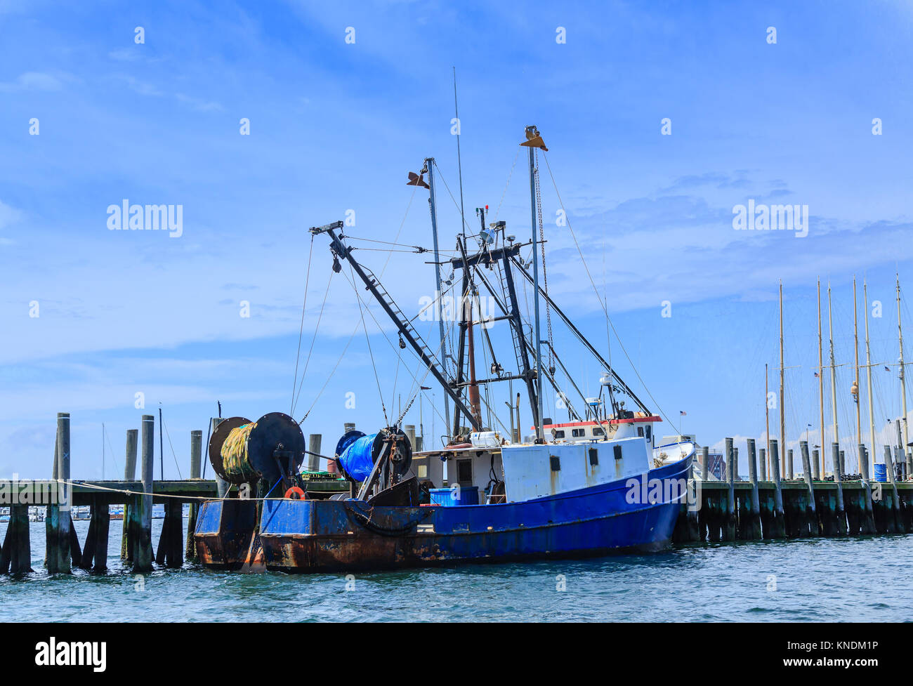 Blue and White Fishing Trawler at Dock Stock Photo - Alamy
