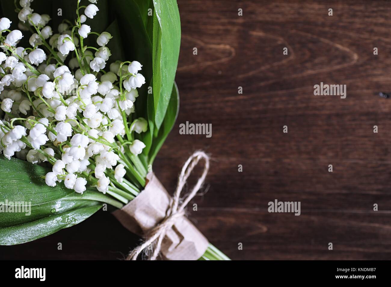 Bouquet of lilies of the valley on a table Stock Photo - Alamy