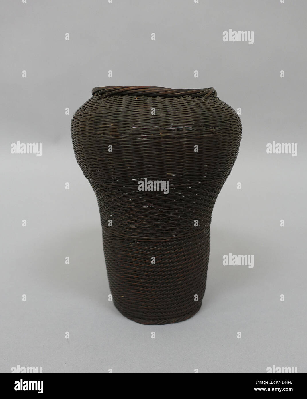 Basket. Date: 19th century; Culture: Japan; Medium: Rattan or bamboo; Dimensions: H. 8 in. (20.3 cm); Classification: Basketry Stock Photo