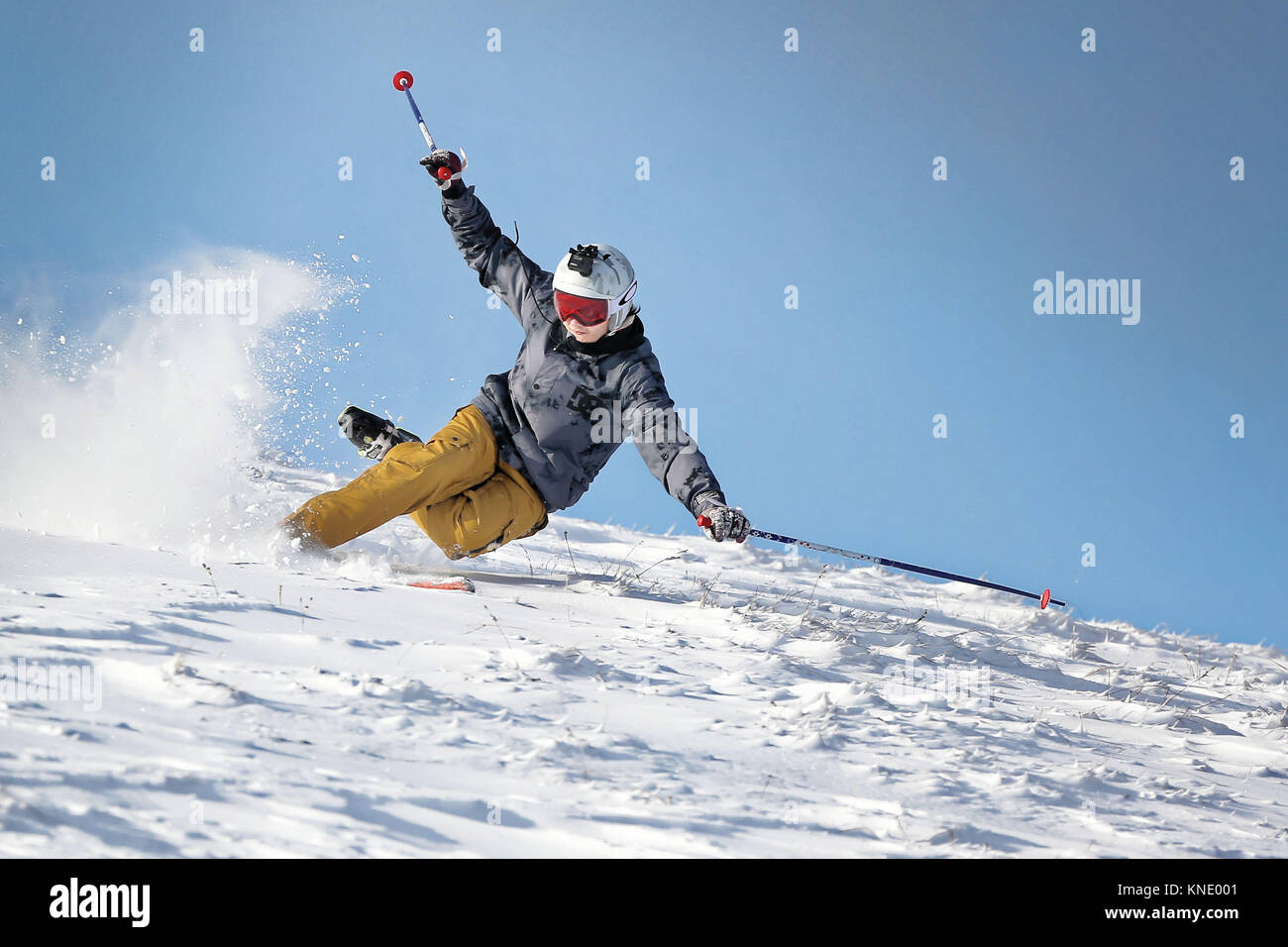 Pictured: A man falls over as he skis in the snow at Storey Arms in the Brecon Beacons, Wales, UK. Monday 11 December 2017 Re: Freezing temperatures,  Stock Photo