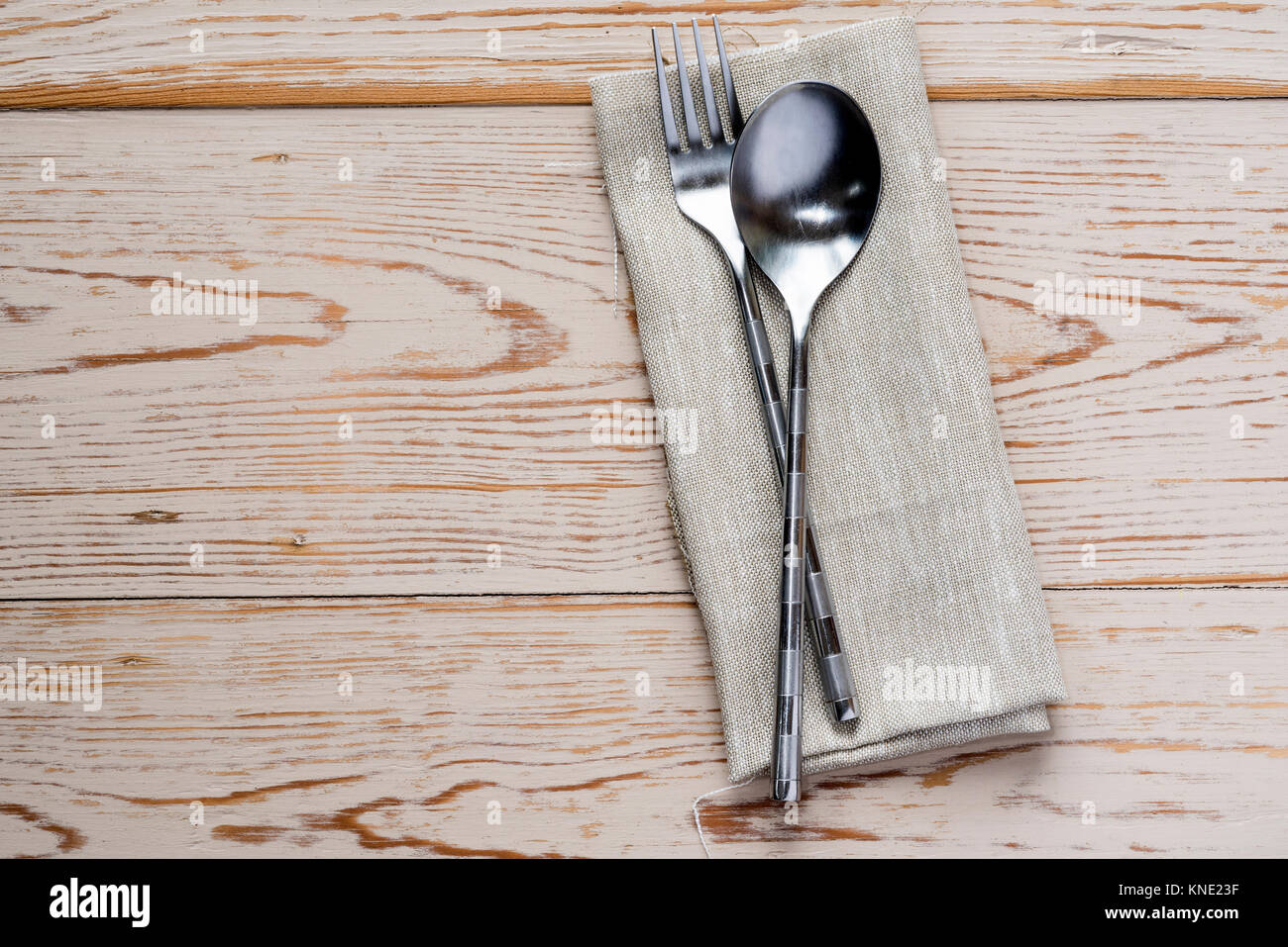Spoon, fork napkin serviette, place setting table setting. Stock Photo