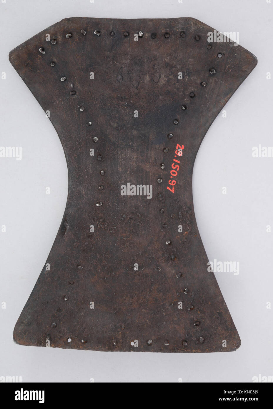 This brigandine backplate, made of metal plates sewn onto fabric, is ...
