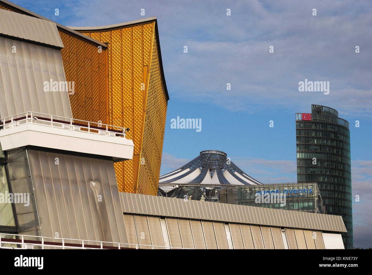 The Berliner Philharmonie theatre, seat of the Berlin Philarmonic Orchestra and the DB tower in the background, Berlin Stock Photo