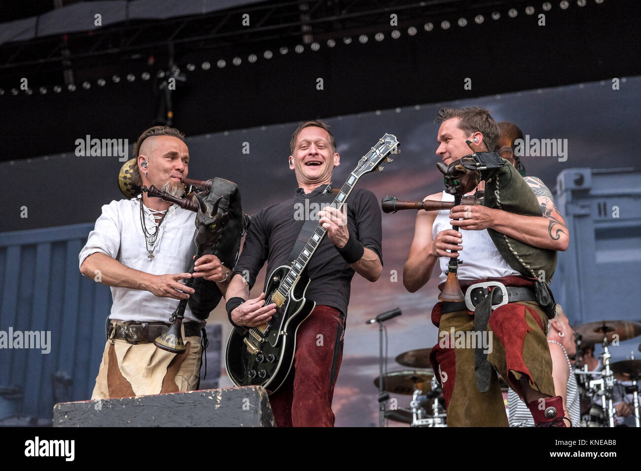 The German power metal band In Extremo performs a live concert at the Swiss music festival Greenfield Festival 2015 in Interlaken. Here musician Boris Pfeiffer (L) is seen live on stage with Marco Ernst-Felix Zorzytzky (R) and guitarist Sebastian Oliver Lange. Switzerland, 12/06 2015. Stock Photo