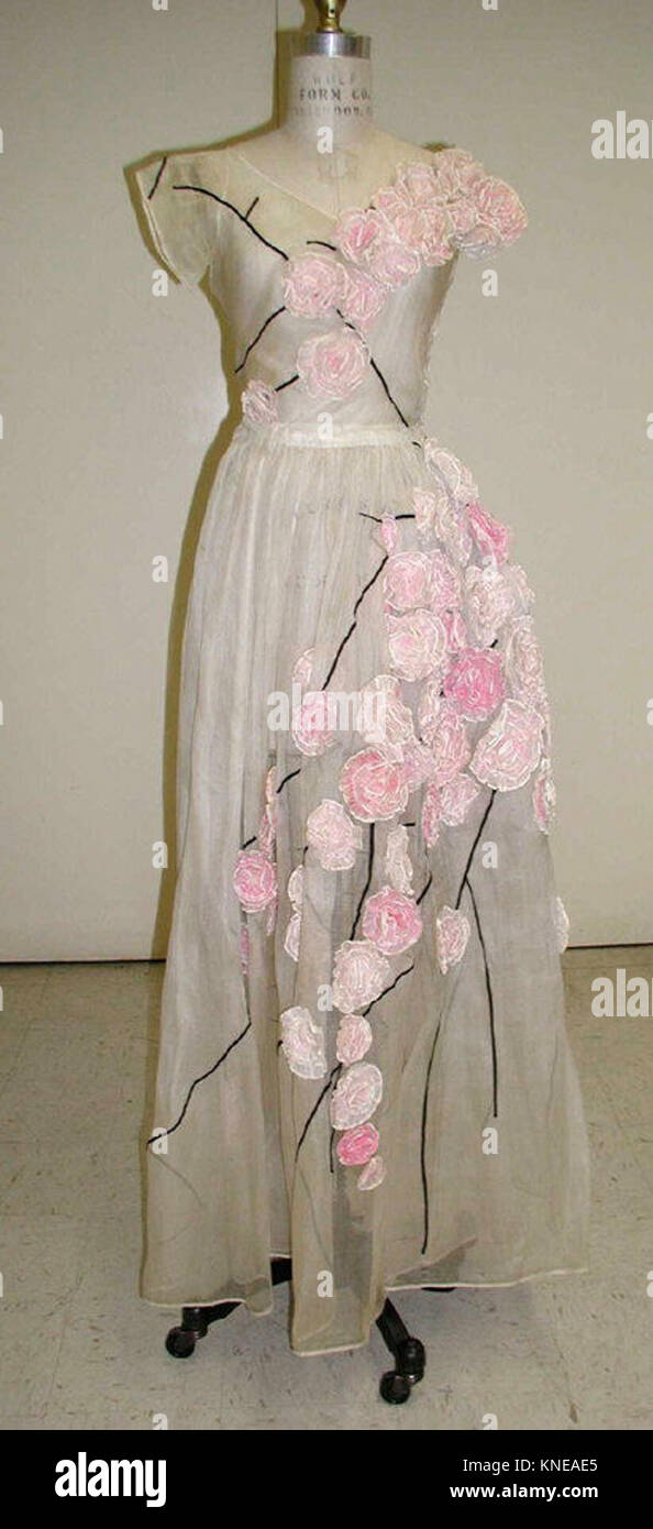 Jeanne Lanvin's 1937 dress for the House of Lanvin blends cotton and silk,  showing the sophistication and fashion trends of the late 1930s with  elegant design and tailored length Stock Photo - Alamy