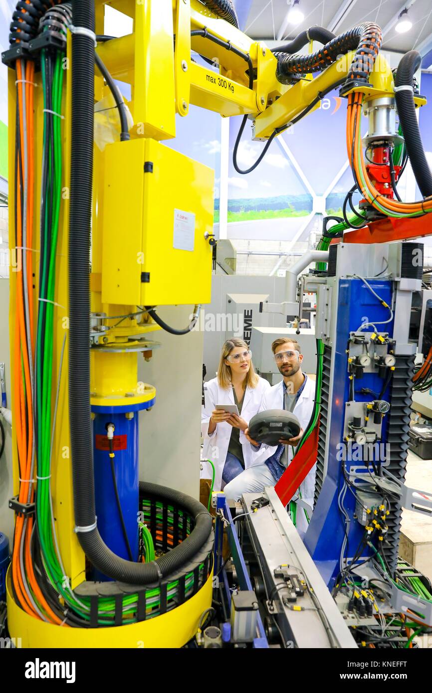 Robotic mobile platform for aeronautical drilling. Researchers working