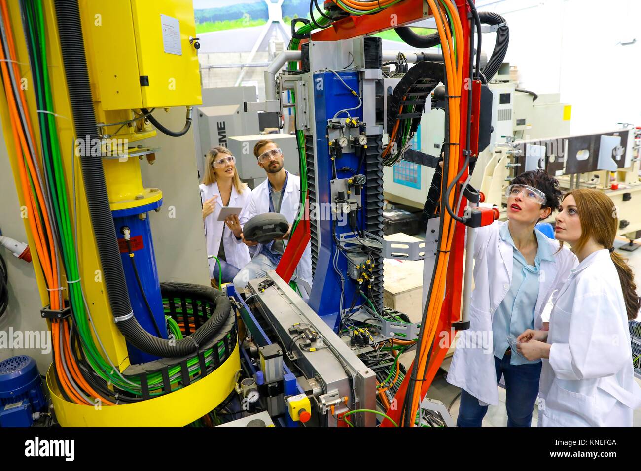 Robotic mobile platform for aeronautical drilling. Researchers working on portable robot to drill holes into aircraft components, Industry, Research Stock Photo