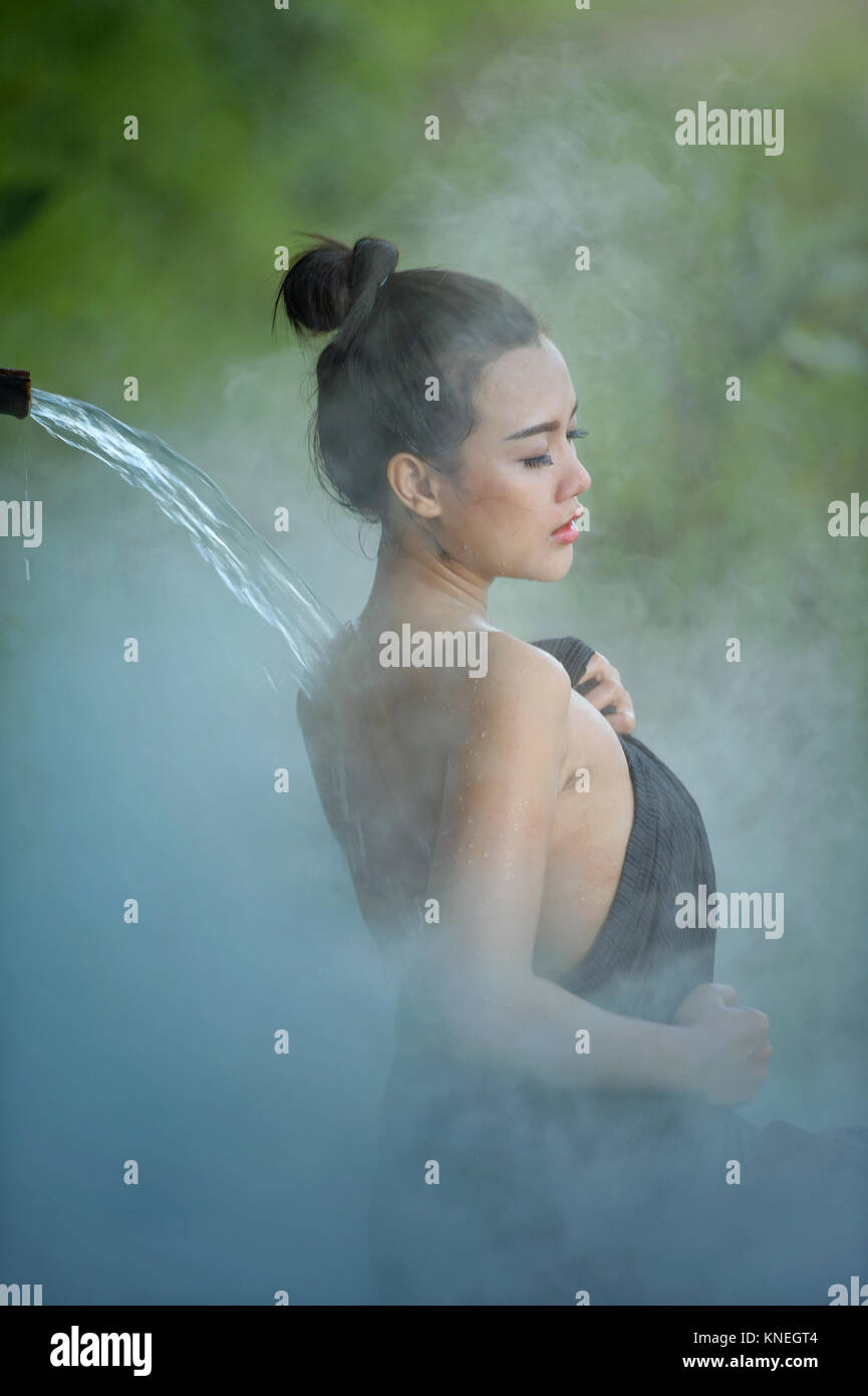 Woman showering in a spa, Thailand Stock Photo