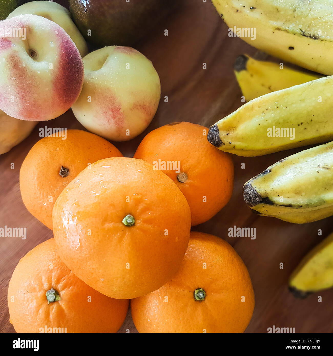Bananas, peaches and satsumas Stock Photo Alamy