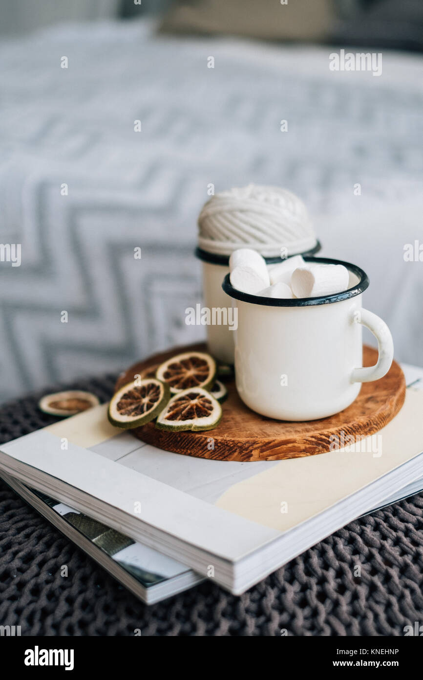 Mug with marshmallows and lemon slices in a bedroom Stock Photo