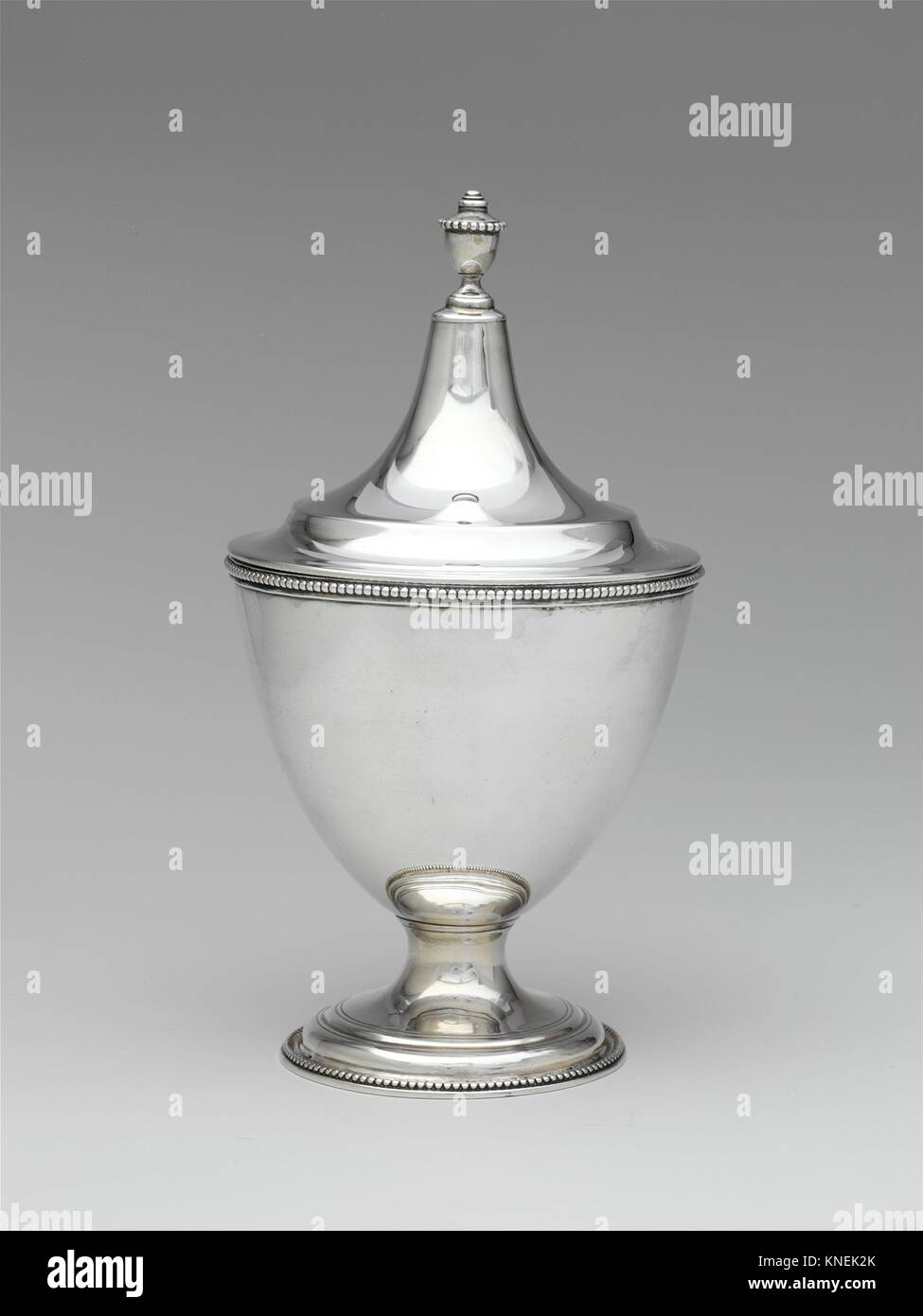 Sugar Bowl. Maker: Marked by R. G; Date: 1795-1810; Culture: American; Medium: Silver; Dimensions: Overall: 8 7/16 x 4 9/16 in. (21.4 x 11.6 cm); 13 Stock Photo