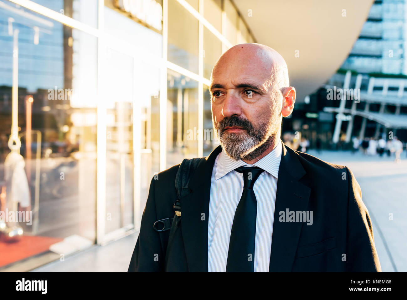Mature businessman walking near hi-res stock photography and images - Alamy