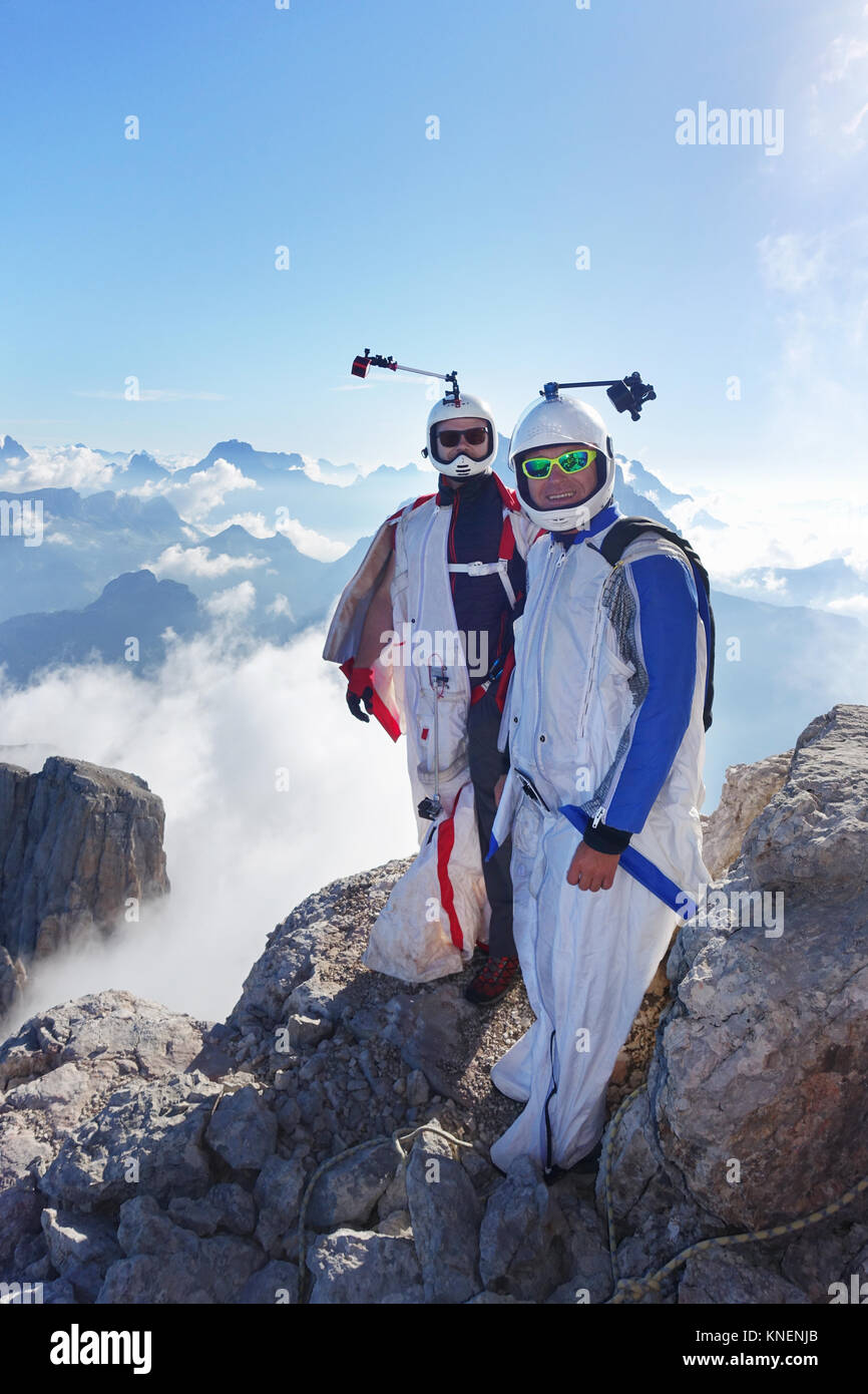 Portrait of two wingsuit BASE jumpers preparing to fly Stock Photo