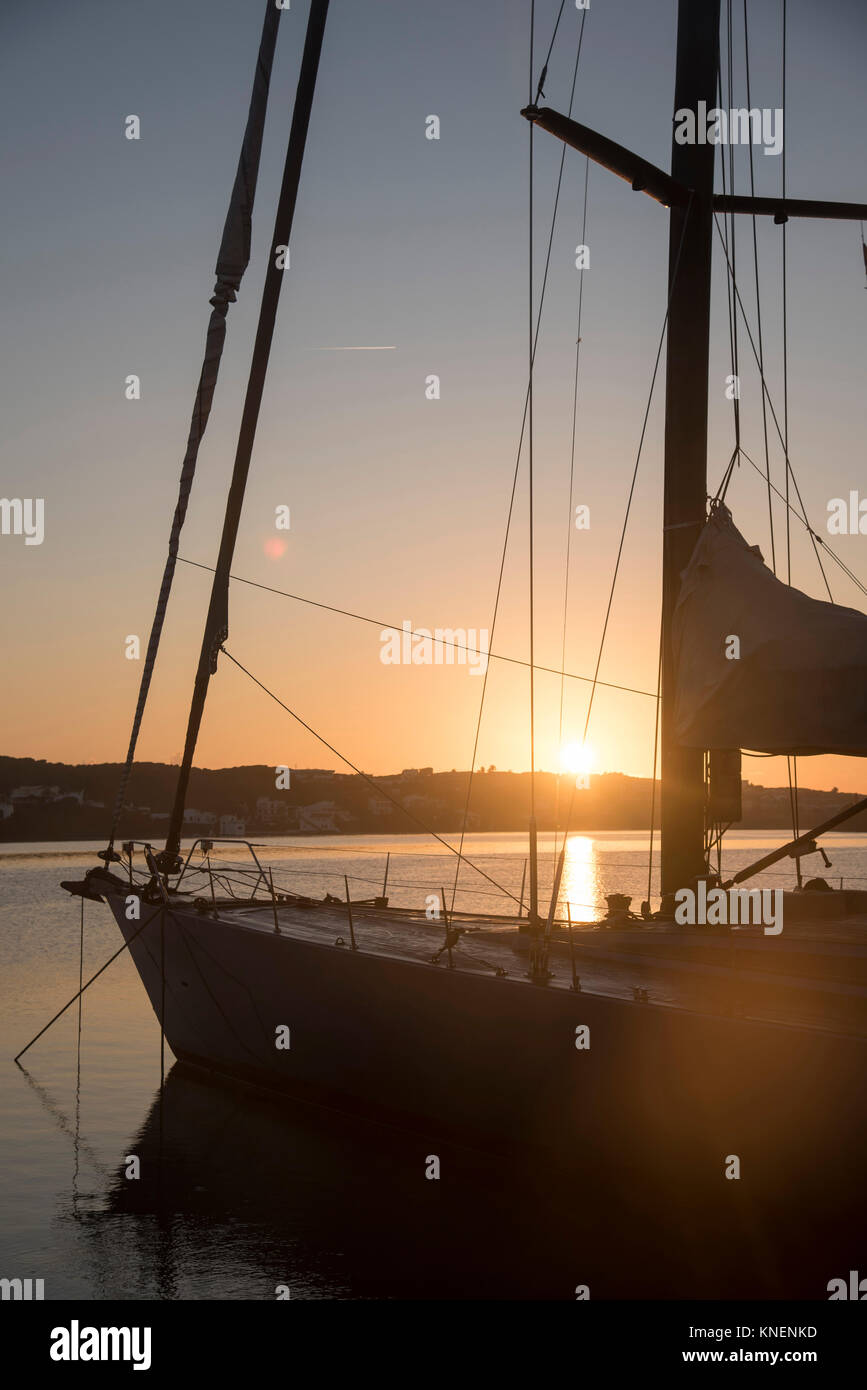 Yacht in harbour at sunset, Mahon, Menorca, Spain Stock Photo