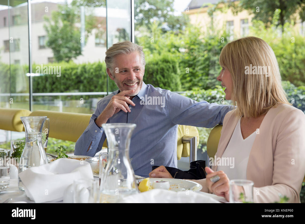 Smiling couple al fresco dining at restaurant Stock Photo