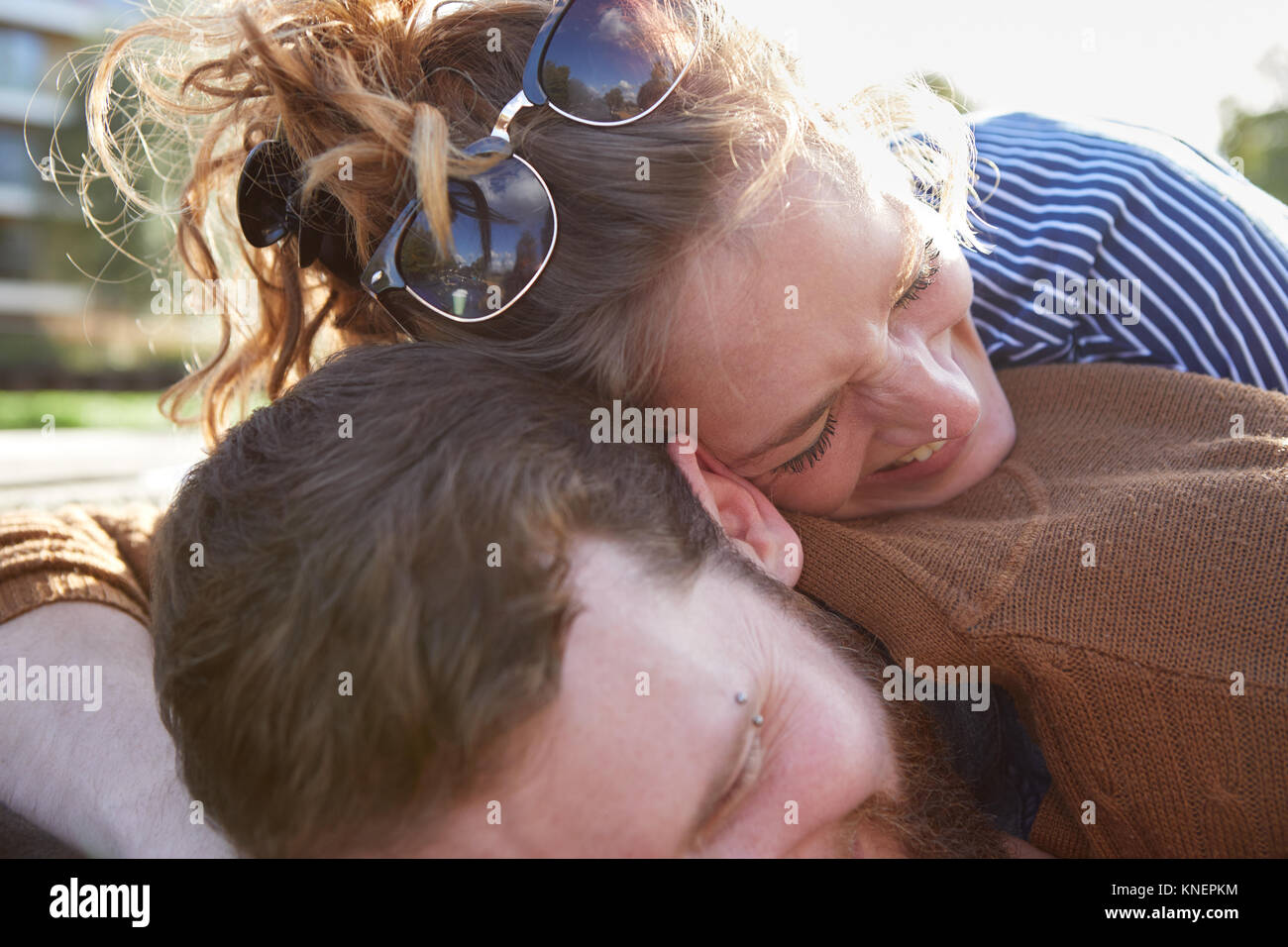 Couple lying on roof of canal boat Stock Photo