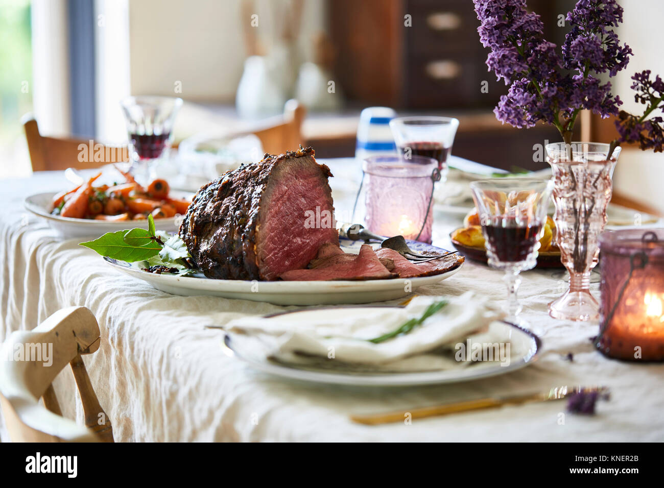 Sunday roast on dining table, ready to serve Stock Photo Alamy