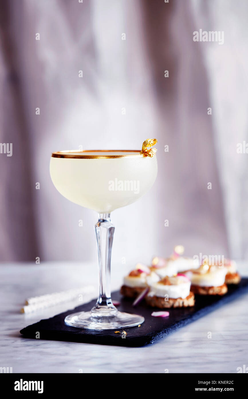 Toffee rum punch, with canapés Stock Photo