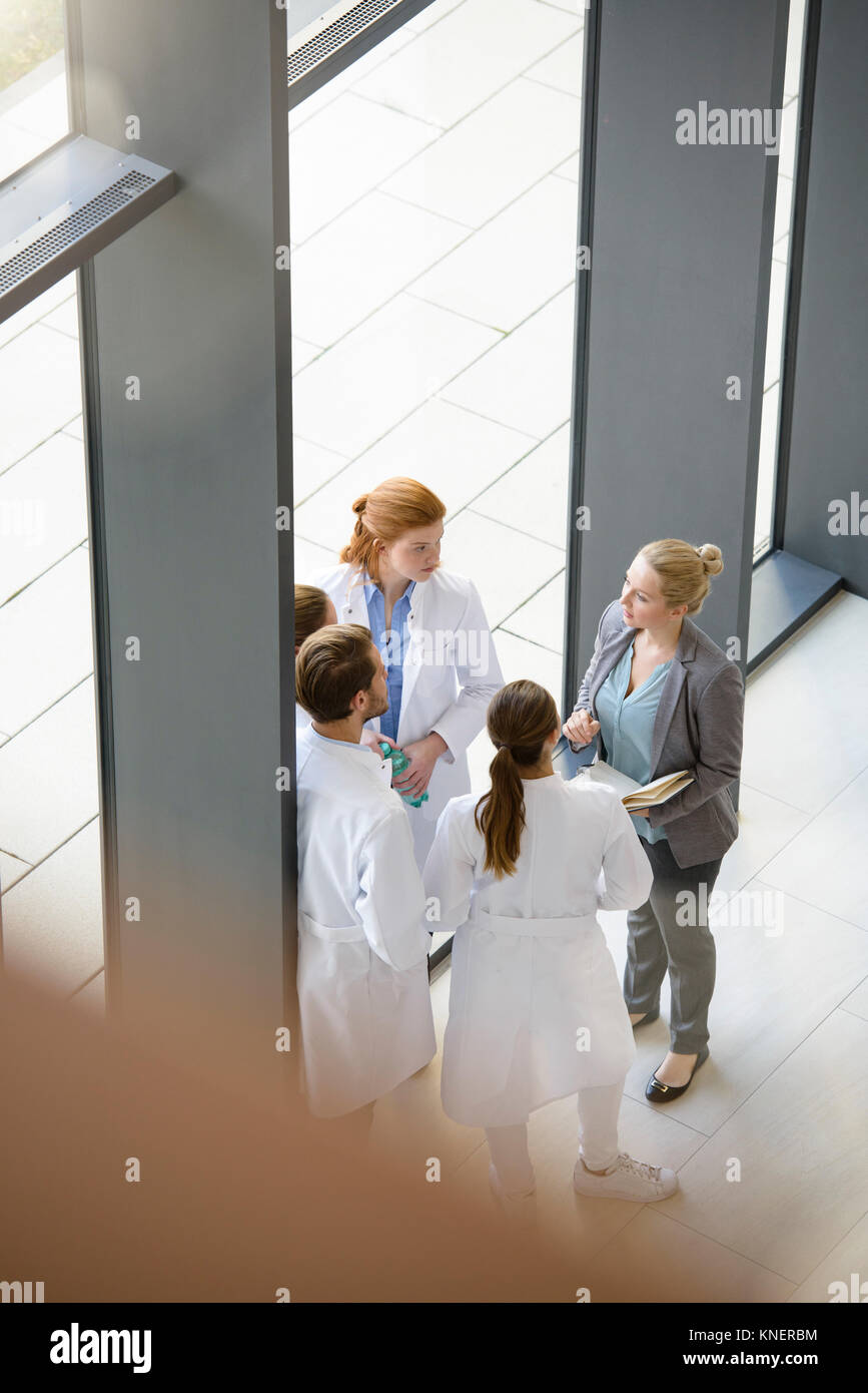Group of doctors having discussion, elevated view Stock Photo