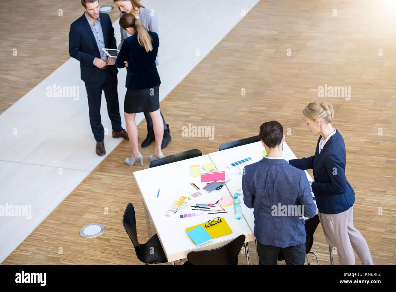 Businesswomen and men having group meeting in office Stock Photo