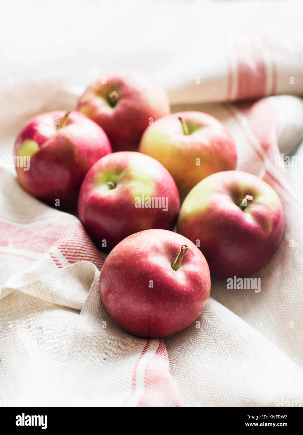 Four Apples - One Big Apple From Shop And Three Homemade Small Apples All  On White Background Stock Photo, Picture and Royalty Free Image. Image  60165001.