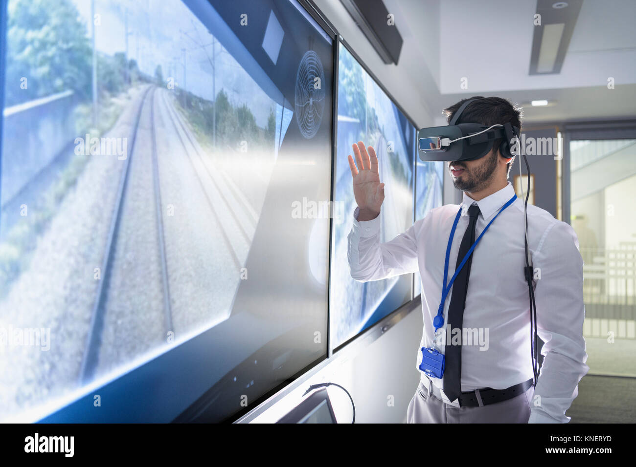 Engineering apprentice using Virtual Reality system in railway engineering facility Stock Photo