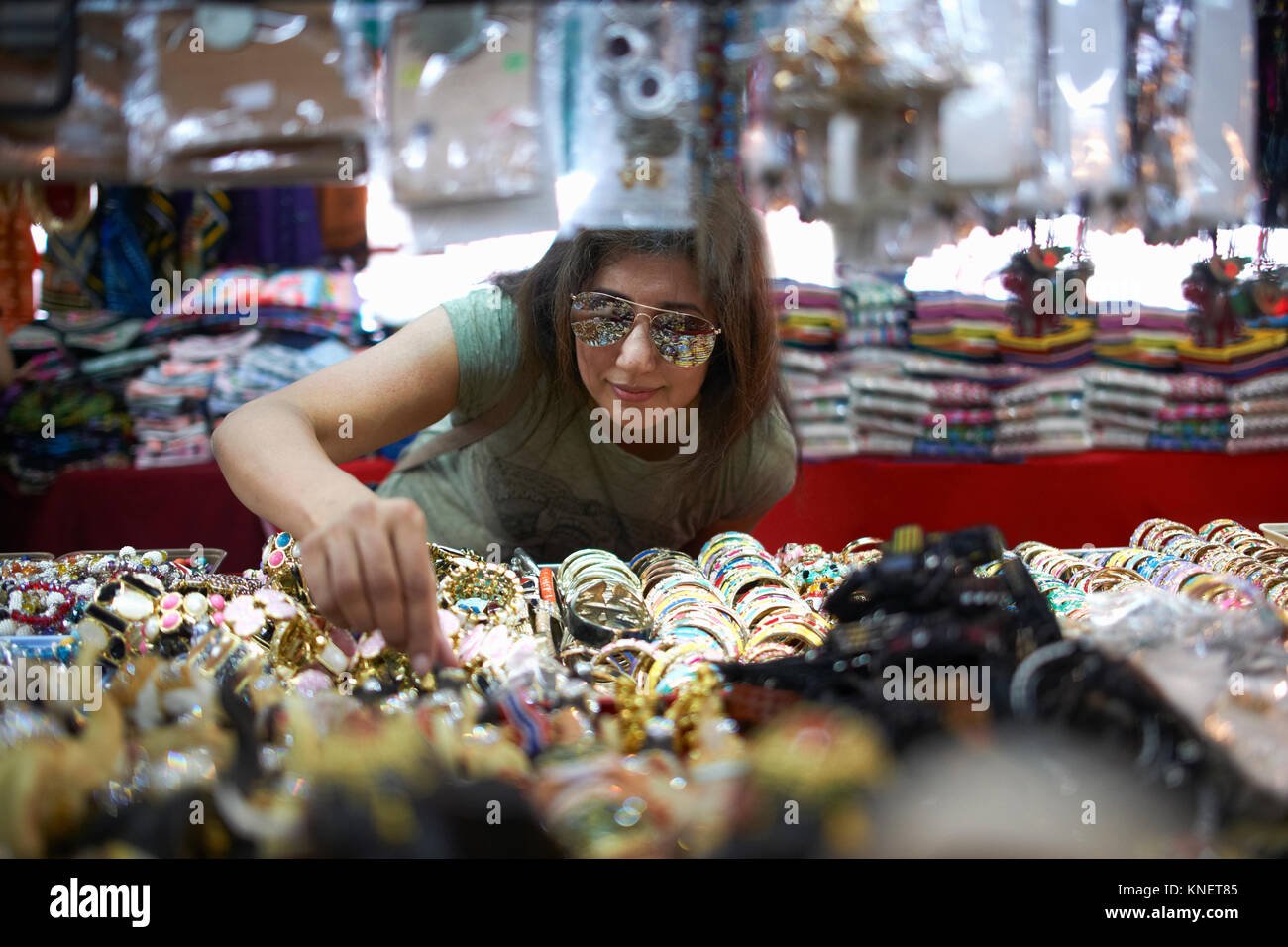 Woman looking at souvenirs on market stall, Bangkok, Krung Thep, Thailand, Asia Stock Photo