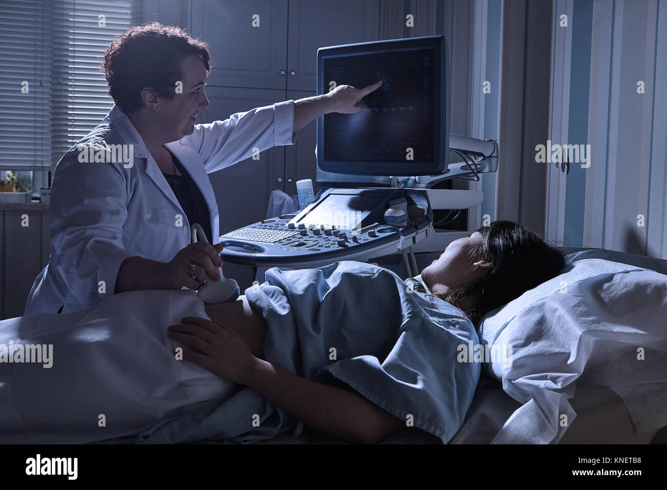 Cropped View Of Sonographer Giving Pregnant Patient Ultrasound Scan