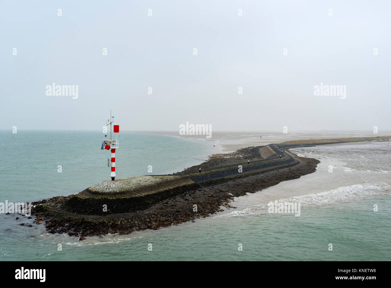 Big pier protecting the harbour from the strong current, West-Terschelling, Friesland, Netherlands, Europe Stock Photo