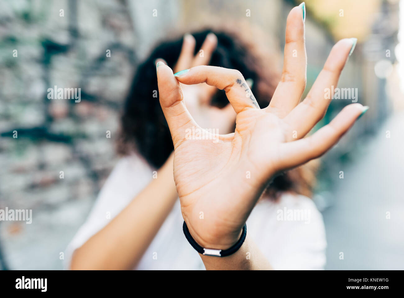 Woman making hand gestures, Milan, Italy Stock Photo