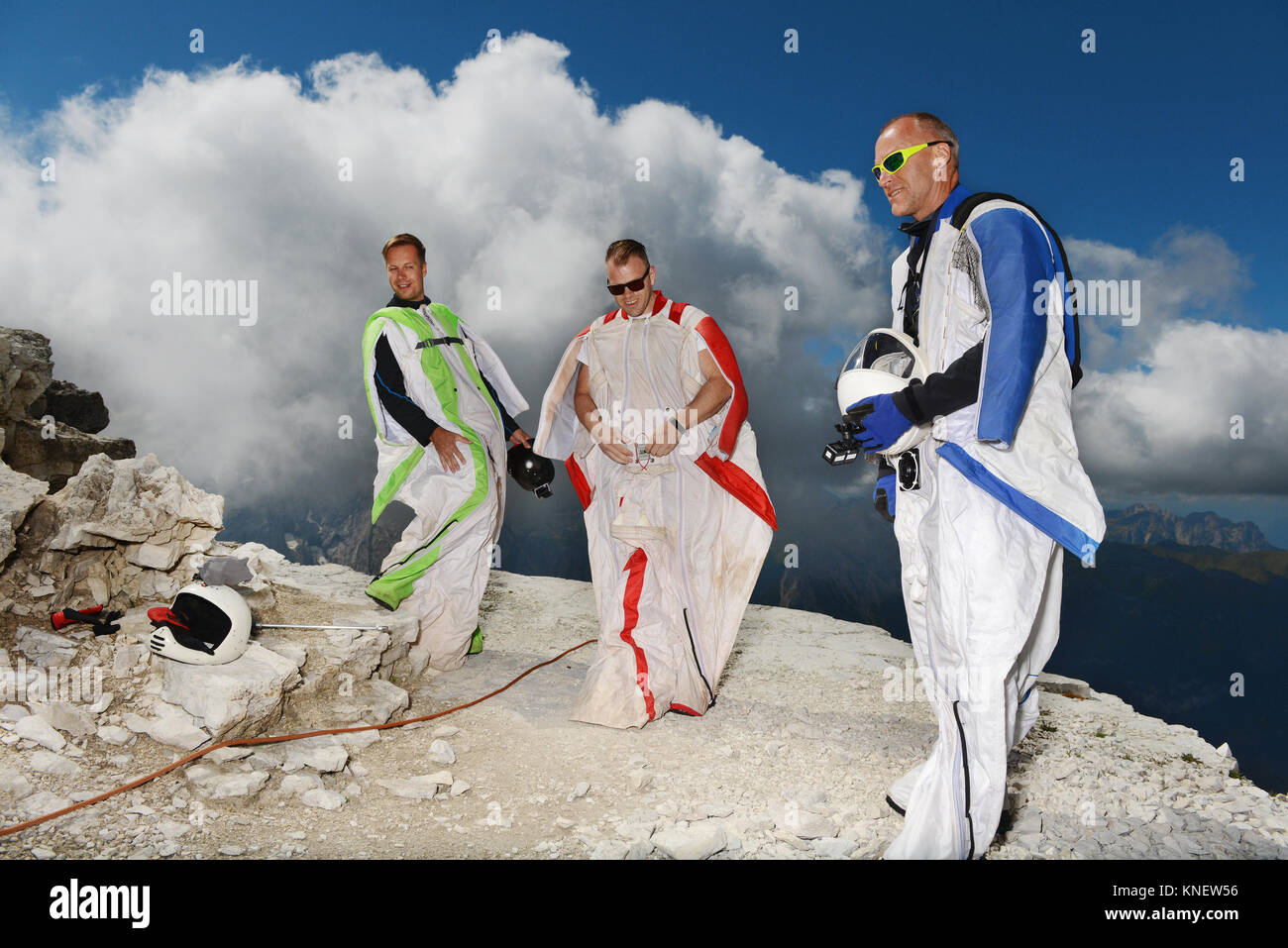 Base jumpers on dolomite mountains wearing wingsuits, Canazei, Trentino Alto Adige, Italy, Europe Stock Photo