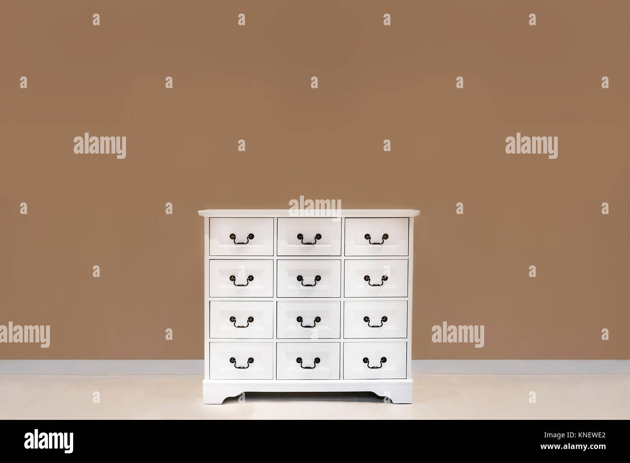 The white color dresser with many drawers Stock Photo