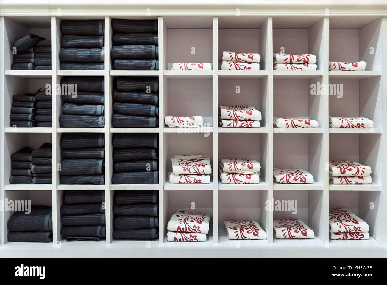 Clean towels every day in a square white shelf. Stock Photo