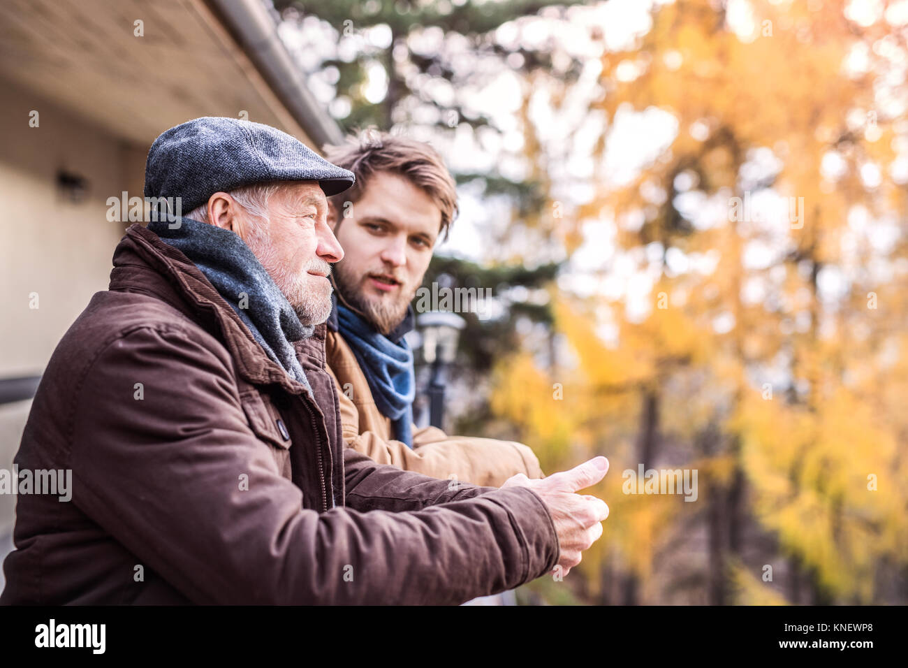 Senior father and his young son on a walk Stock Photo - Alamy