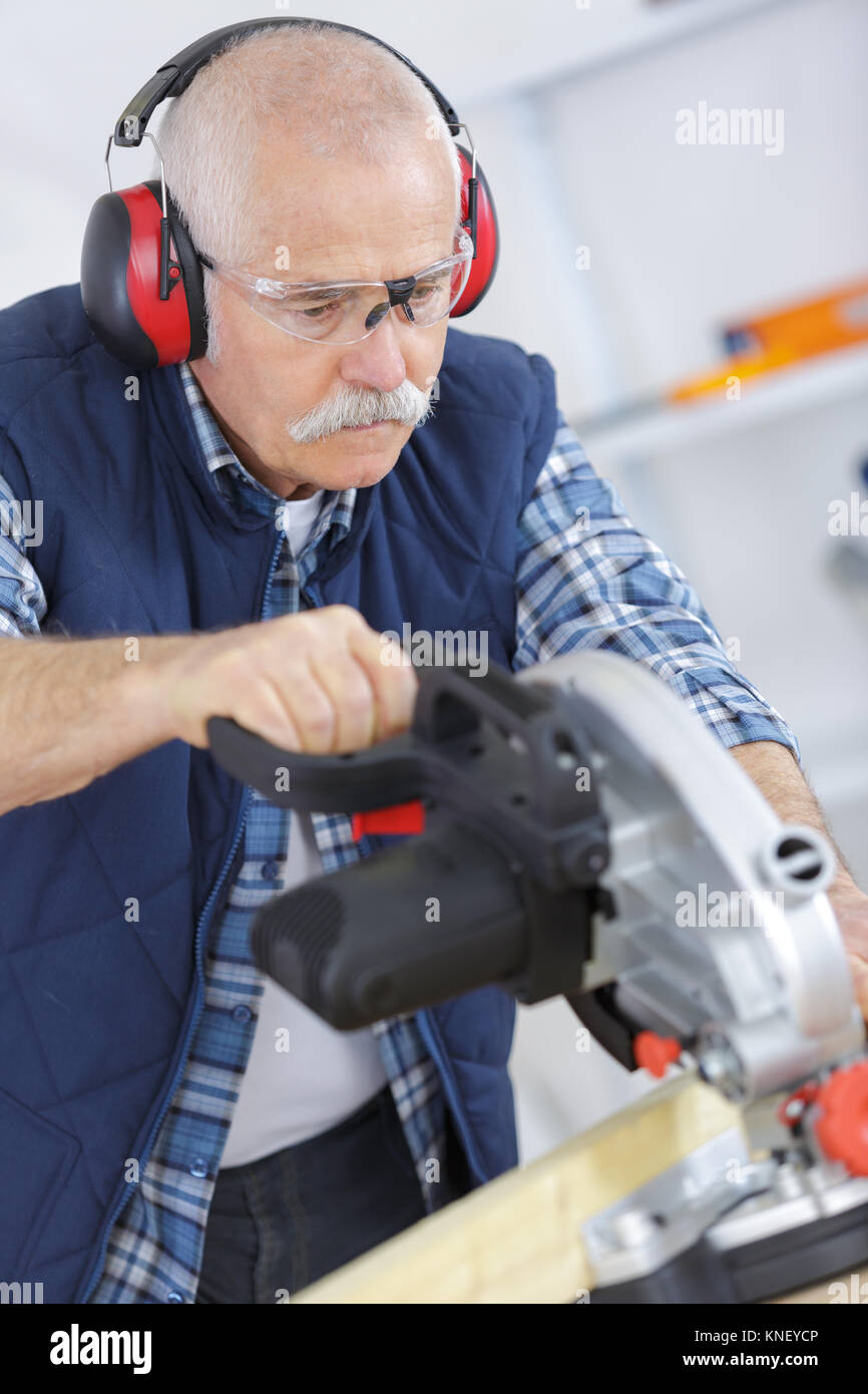 man cutting wood with circular saw Stock Photo Alamy