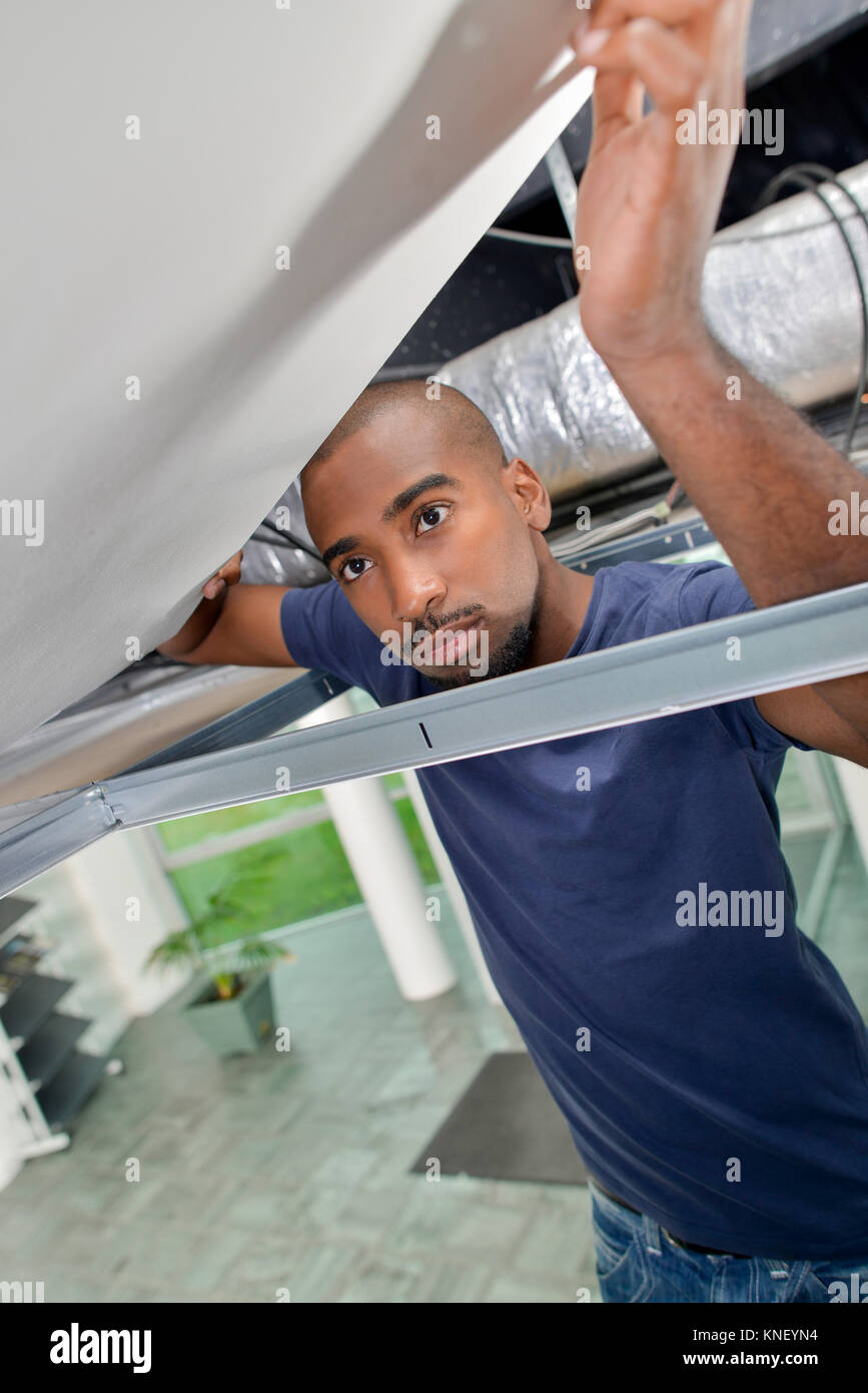 Removing ceiling panels Stock Photo - Alamy
