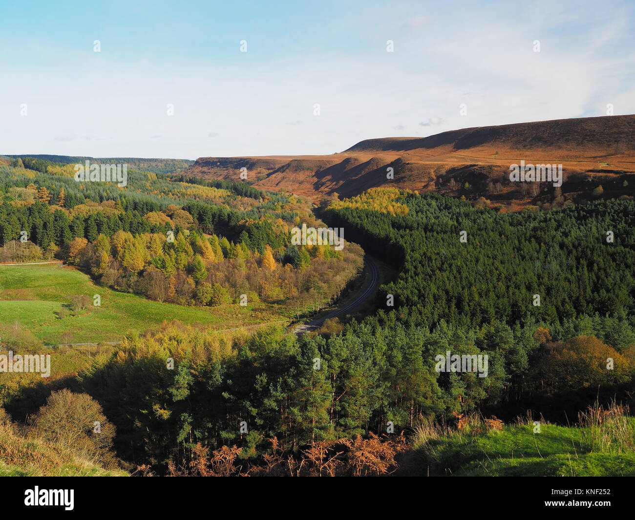 Railway winding its way through a wooded valley Stock Photo