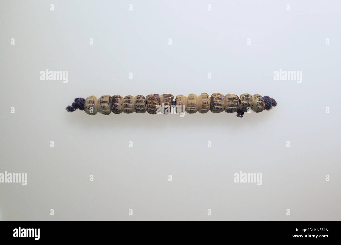 Beads, 6. Culture: Roman; Medium: Glass; Dimensions: Other: 4 7/16 x 1/2 in. (11.2 x 1.3 cm); Classification: Glass Stock Photo